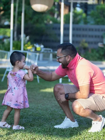 A sweet fist bump between a father and his daughter on our lawn. These are the heartwarming moments that make my day.