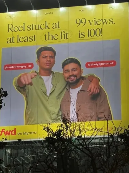 The billboard featuring the male influencers, demonstrating my experience in providing grooming and natural makeup services for men in commercial shoots.