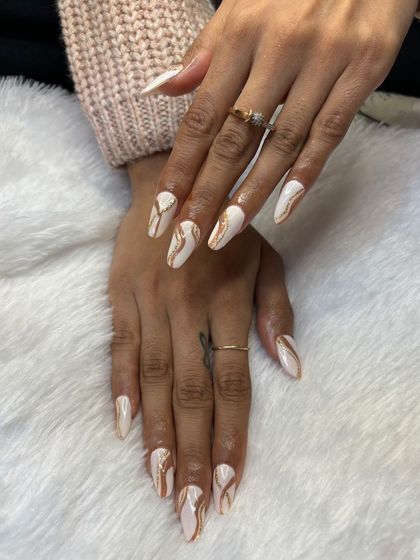 Another example of excellent student work. This white and gold marble design shows their command of texture and color blending.