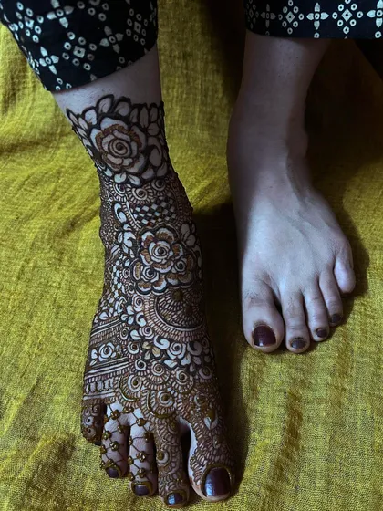 Another view of the "one foot done" concept, emphasizing the artistry and detail that goes into each bridal foot design.