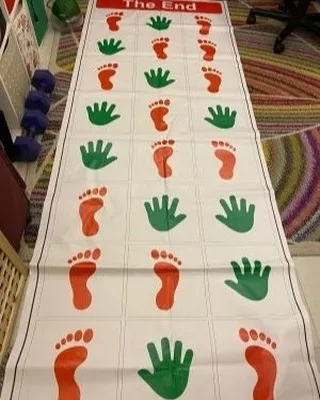 The Hand and Feet game mat, a fun physical activity similar to Twister or Hopscotch. It's a great way to get kids and even adults moving and laughing at a party.