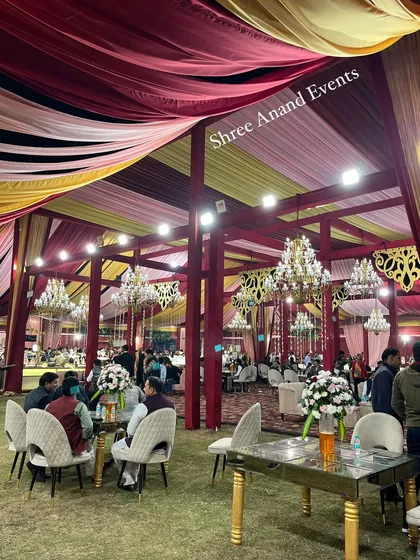 Guests mingling in the spacious event area, with a mix of table seating and lounge sofas to accommodate everyone comfortably.