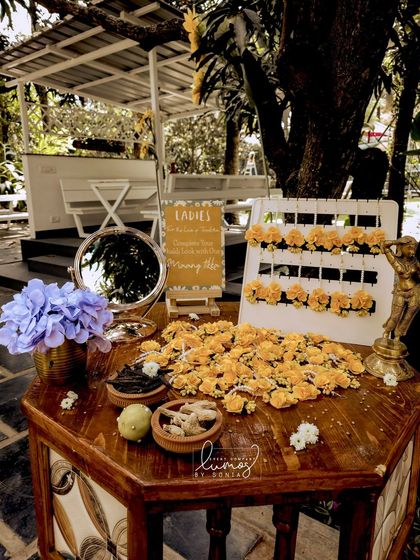 Another view of the Maang Tikka station, with a mirror and traditional brass statue.