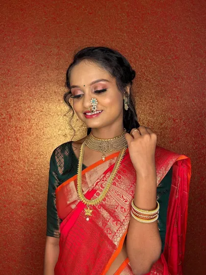 A soft, smiling pose that shows off the subtle yet beautiful makeup.