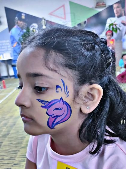 A simple, bold unicorn silhouette in purple and blue, a great choice for a quick and stylish design.