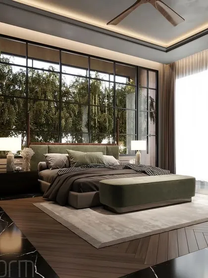 I designed this modern bedroom to be a retreat embraced by nature. The floor-to-ceiling windows blur the line between indoors and out, while the black marble floor provides a dramatic contrast to the green and earthy tones.