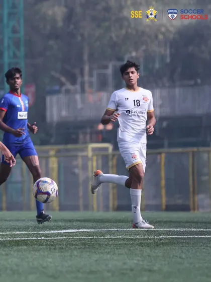A player tracks back to defend, showcasing the work rate and discipline we expect from every member of our team.