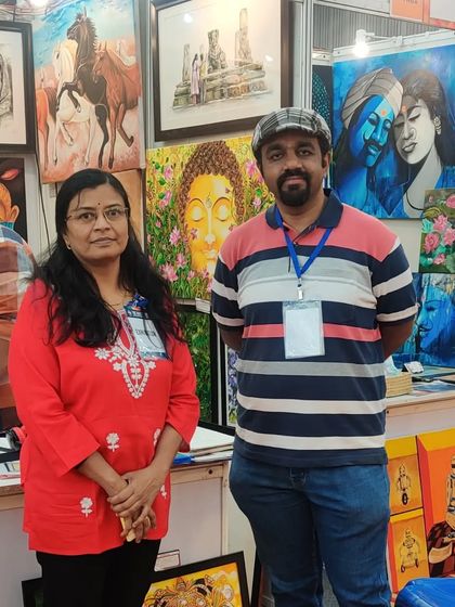 With a fellow artist at my busy stall.