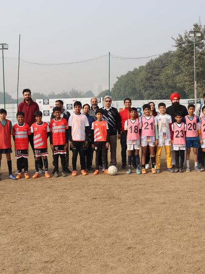 Our senior team stands united with coaches and officials at the HCL Future Stars Grassroots League, representing the club with pride.