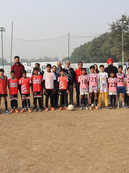 Our senior team stands united with coaches and officials at the HCL Future Stars Grassroots League, representing the club with pride.
