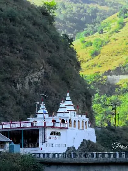 The Bhuteshwar Maharaj Maipul Temple situated by a bridge over the river. This photo captures the temple's connection to the local geography and the essential role of rivers in the region.