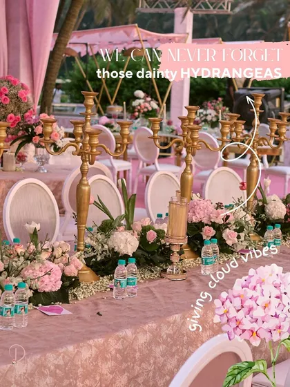 Highlighting the use of dainty hydrangeas in the tablescape, which give a soft, cloud-like texture to the floral designs.