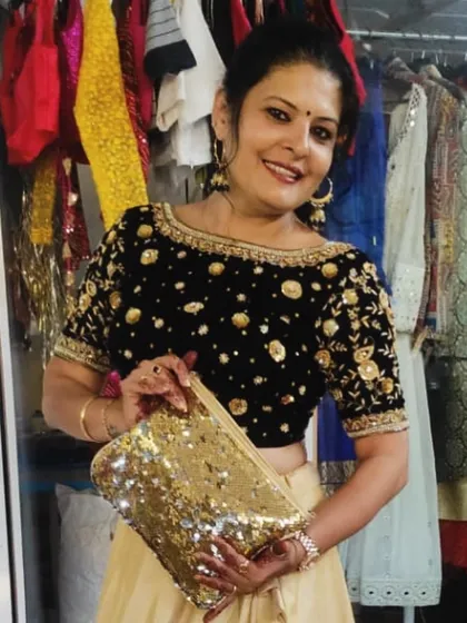 For my brother's sangeet, I designed this black velvet blouse with rich zardozi and sequin embroidery. I paired it with a flowing soft silk lehenga to create a look that's both regal and ready to dance.