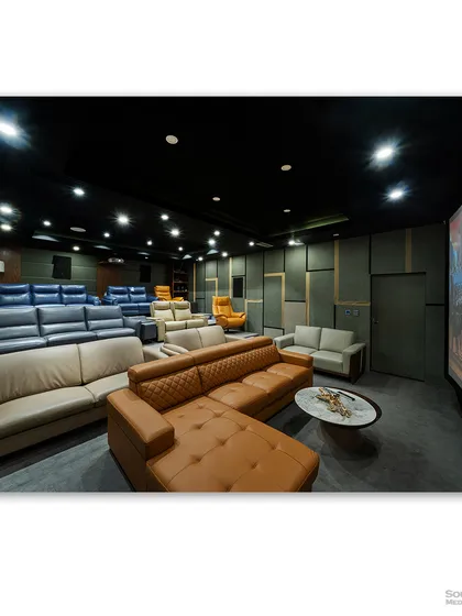 A luxury home theater showroom, displaying a variety of high-end seating options from plush recliners to comfortable sectional sofas. The image showcases the range of products in a realistic, cinematic setting.