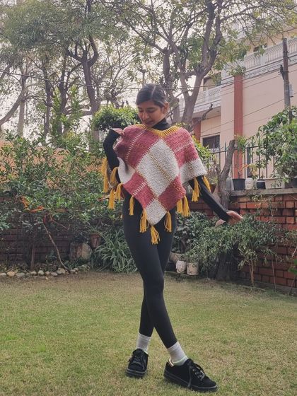 The asymmetrical design of this poncho makes it so unique and flattering to wear. I love how the colors came together in this piece.