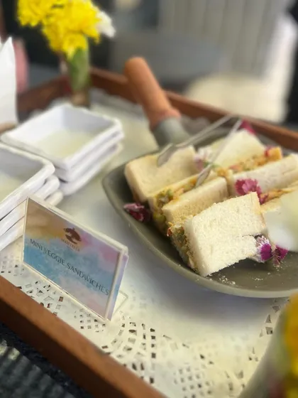 Mini vegetable sandwiches, a classic high-tea offering. We make them with fresh bread and a creamy vegetable filling, perfect for corporate events, baby showers, or afternoon parties.