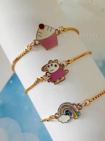 These adjustable charm bracelets are perfect for party favors. This set includes cute Peppa Pig, cupcake, and rainbow enamel charms on a delicate gold-colored chain.