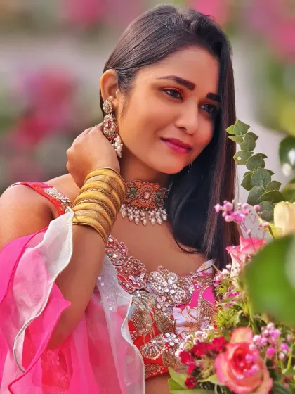 A close-up shot amidst the floral arrangements. The soft pinks and whites of the flowers perfectly complemented my outfit and the romantic vibe of the Mehndi.
