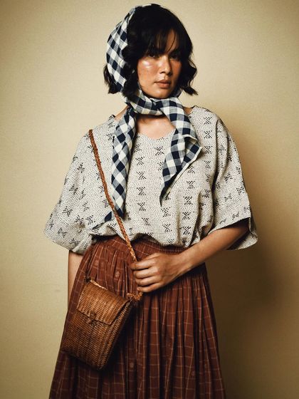 A styled studio portrait for House of Wandering Silk, combining different patterns and textures for a chic, layered look.