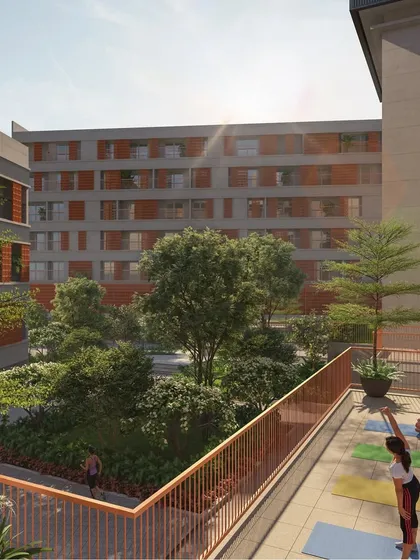 I design spaces for living, not just for looking at. This terrace yoga deck, part of a community housing project, overlooks a central green courtyard, providing residents with a dedicated space for wellness that is deeply connected to nature.