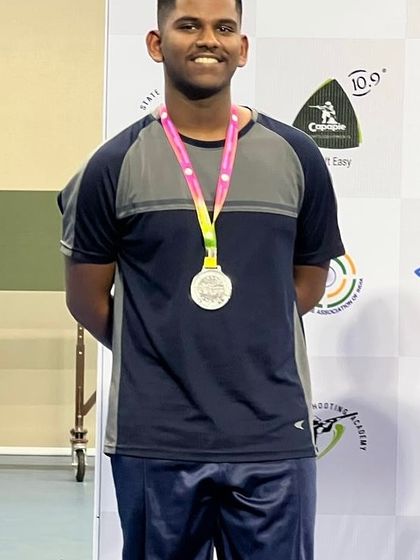 A close-up of a champion. Darren Dawn proudly displays his Silver Medal from the KSS National Championship, a result of his consistent effort and our focused competition training.