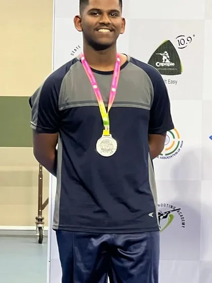 A close-up of a champion. Darren Dawn proudly displays his Silver Medal from the KSS National Championship, a result of his consistent effort and our focused competition training.