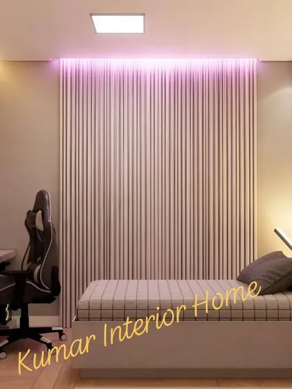 This view shows the gaming desk and chair next to the bed, creating a dedicated zone for play.
