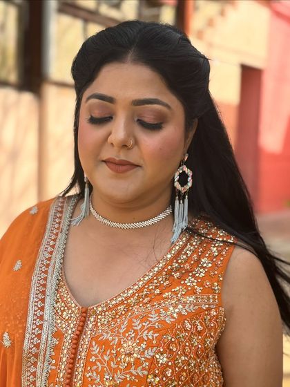 Another angle showing the soft glam makeup with eyes closed, focusing on the seamless eyeshadow blend and defined brows.