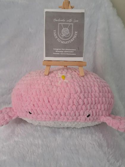 The pink whale pillow with my brand card. I can customize the color and embroidery to create a unique piece for your home.