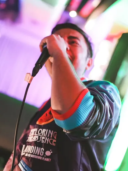 It's not just about playing music; it's about leading the party. Here I am on the mic, hyping the crowd and making sure everyone feels the beat. This is how I connect with your guests.