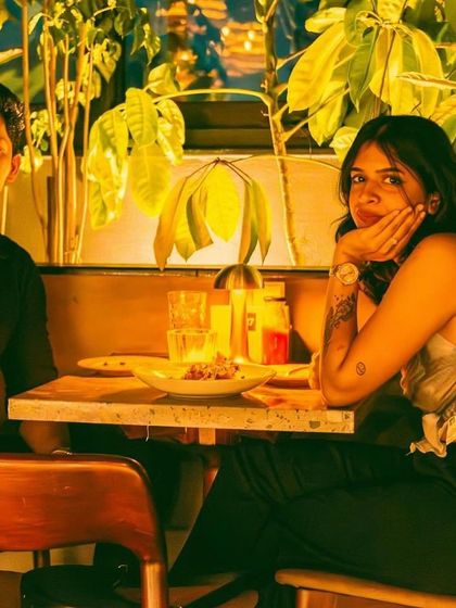 A couple enjoying a quiet moment at their table at TYD.