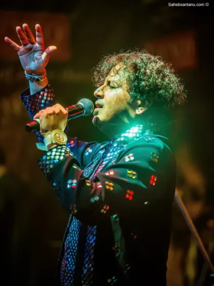 Our lead vocalist, lost in a moment of soulful expression. We bring authentic emotion to every stage we grace.