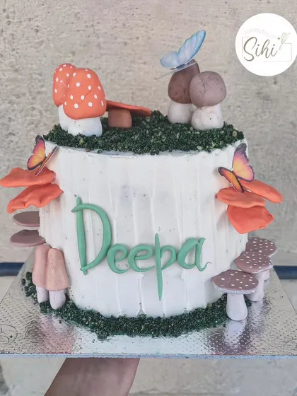 The cake brief was "mushrooms, lots of mushrooms." I loved creating this magical forest-themed cake with various types of hand-sculpted fondant mushrooms and edible butterflies.