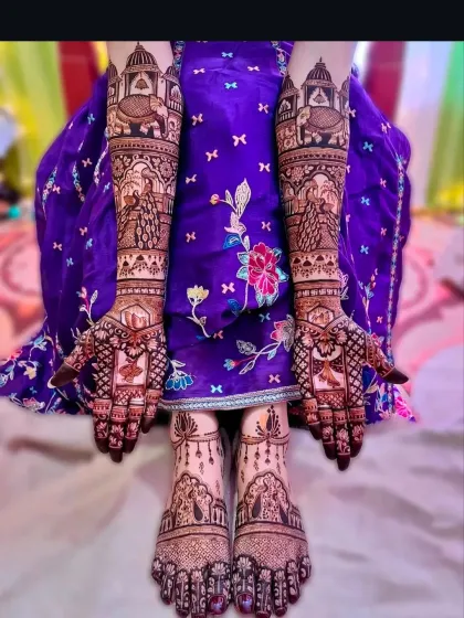 A complete bridal look with matching designs for hands and feet. The artwork includes traditional motifs like elephants and palaces, ensuring a cohesive and royal look for your big day.