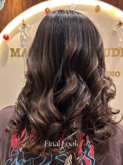The final look of this beautiful transformation. We created a rich brown base with subtle highlights for dimension, resulting in a sophisticated and sassy style.