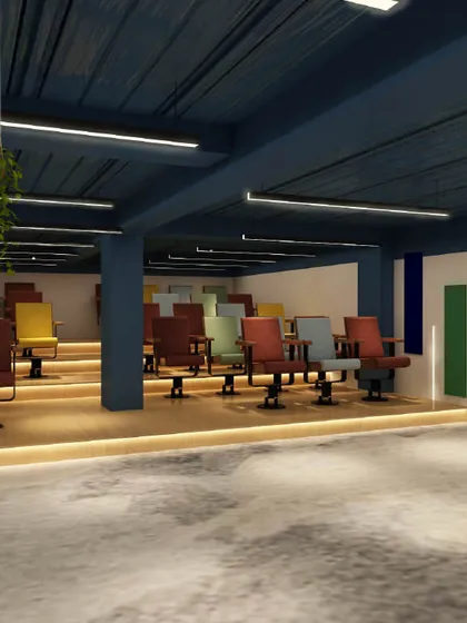 A recreational space in an office designed for presentations or team gatherings. The tiered seating with colorful chairs creates a vibrant and dynamic atmosphere.