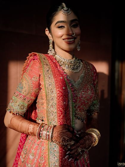 A beautiful close-up of the bride, with the warm sunlight highlighting her flawless makeup and stunning jewelry. These are the details we help perfect.