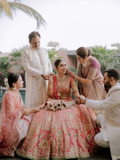 The bride surrounded by the love and blessings of her entire family. We make sure to capture these important group portraits in a beautiful and meaningful way.