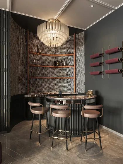 A cozy bar nook is tucked into the corner of the entertainment lounge, featuring a dramatic chandelier and a patterned backsplash. It’s a space designed for intimate conversations.