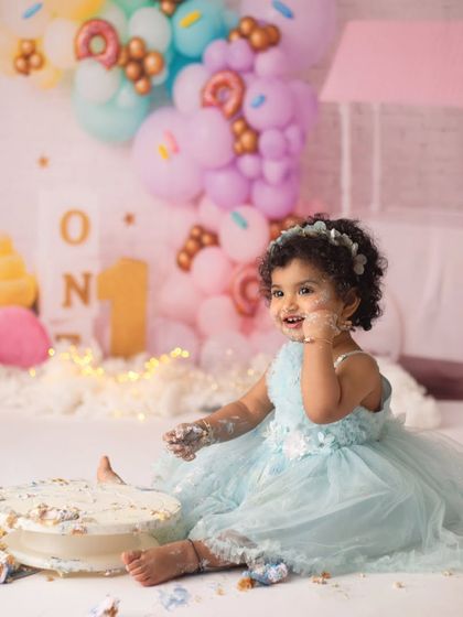 A tiny taste of birthday cake. I love these candid moments during a cake smash session where their curiosity and joy take over.