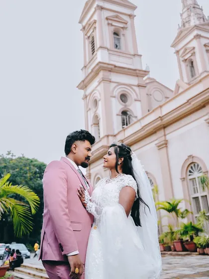 A romantic portrait of the newly married couple outside the church, sharing a look of love.