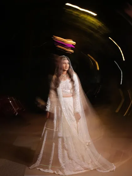 A creative wedding portrait using a circular motion blur technique for an abstract and artistic feel.