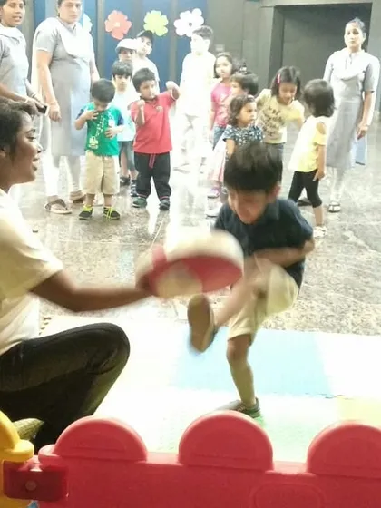 Teaching a young boy how to throw a proper kick. These drills help develop balance, coordination, and power from a very early age.