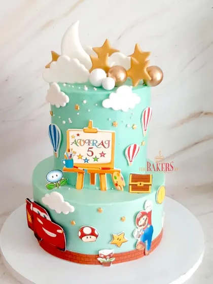 A "Joyland" theme cake for Aviraj's 5th birthday, featuring all his favorite things! This two-tier cake includes Lightning McQueen, Super Mario, stars, hot air balloons, and a painting easel.