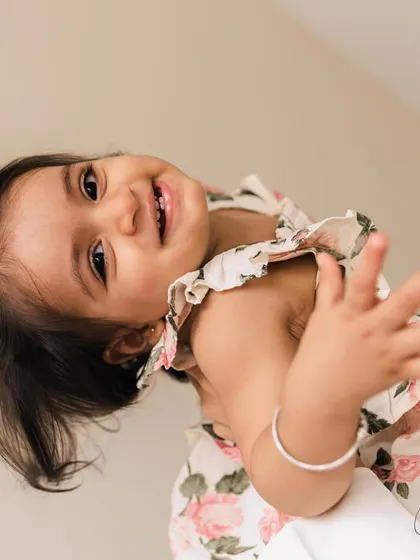 That six-toothed smile says it all. I focus on capturing the little details of your baby's first year, from their tiny expressions to their infectious giggles, creating memories you will cherish forever.