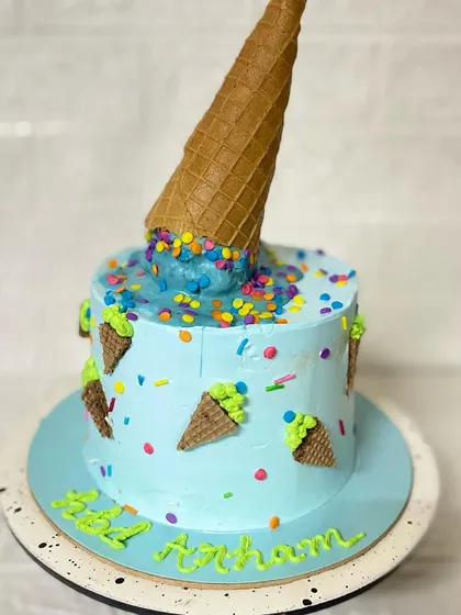 When cake and ice cream meet. This fun butterscotch cake is designed to look like a melting ice cream cone, complete with colourful sprinkles.