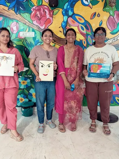 Participants from the 3rd edition of the Awakening Shakti workshop proudly display the art they created, each piece a unique expression of the divine feminine.