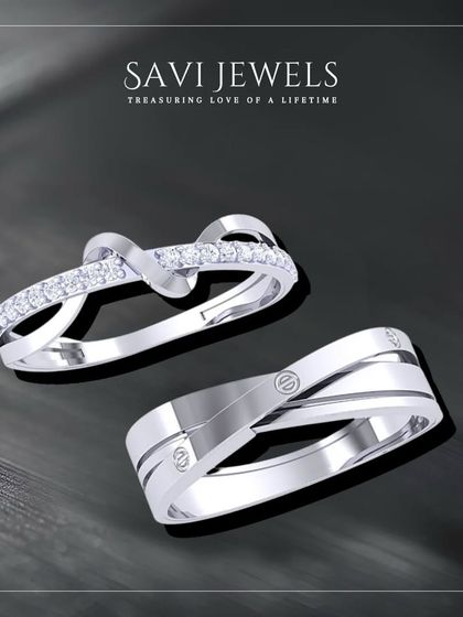 A modern take on couple's rings. This set features sleek, interlocking bands in white gold, one with a delicate row of diamonds, representing two lives becoming one.