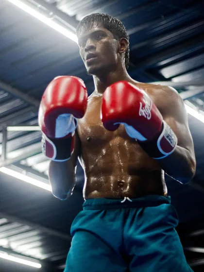 The focus and intensity required for combat sports. This is the look of an athlete in the zone, ready for the next round. Our training builds this mental fortitude just as much as physical strength.