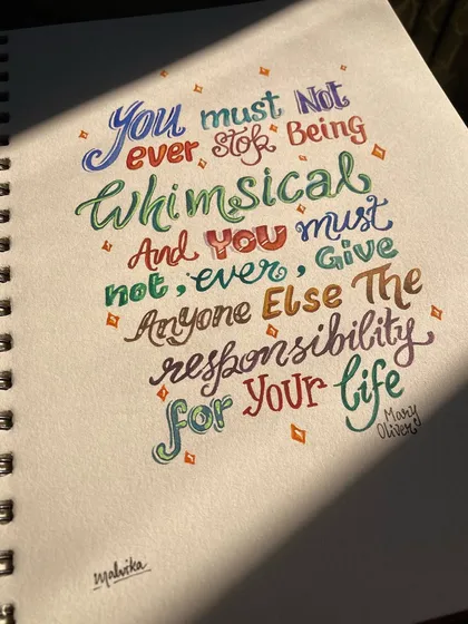 A different angle of the Mary Oliver quote, with sunlight falling across the sketchbook page. This photo captures the handmade feel of the piece and the joy of creating something with my own hands.
